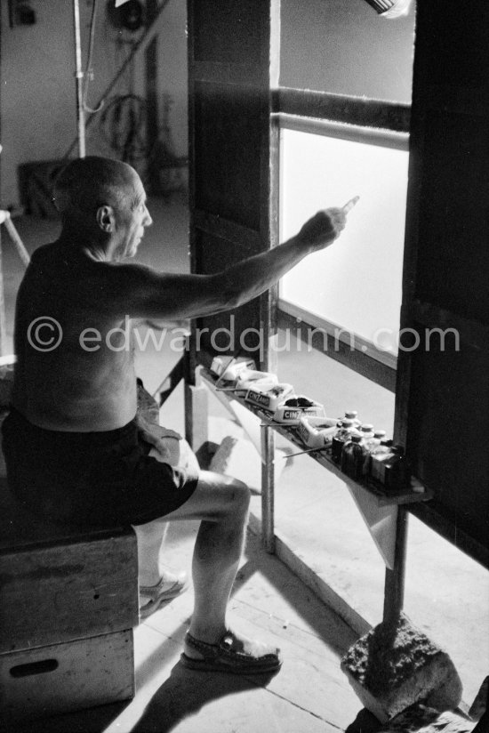 Something begun as a bouquet has become first a fish, then a cock, and finally the head of a faun. Pablo Picasso at work during filming of "Le mystère Picasso". Nice, Studios de la Victorine, 1955. - Photo by Edward Quinn