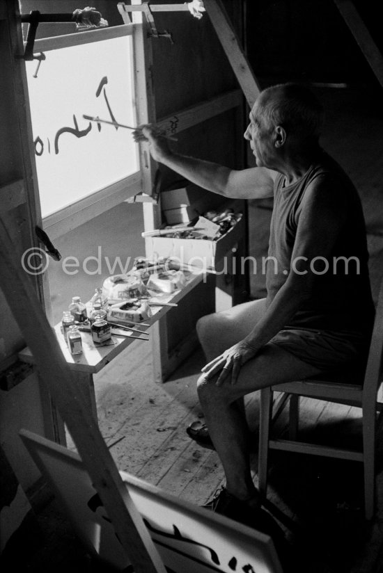 Pablo Picasso working on "La Célestine" where he had to do his signature backwards. "Le mystère Picasso", Nice, Studios de la Victorine 1955. - Photo by Edward Quinn