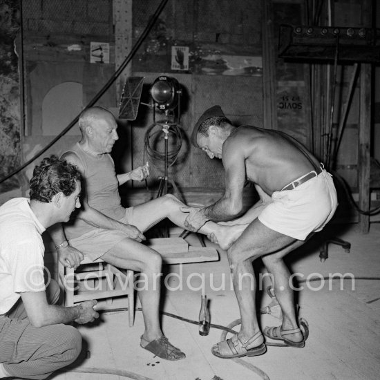 Picasso gets a massage. On left Francisco Reina "El Minuni”, banderillero andaluz. "Le mystère Picasso”, Nice, Studios de la Victorine 1955. - Photo by Edward Quinn