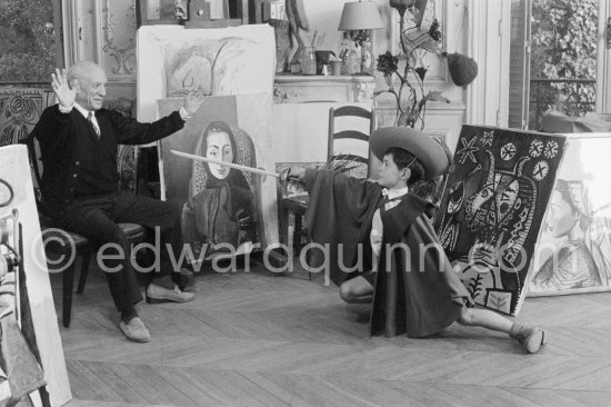 Pablo Picasso with Claude Picasso in a "swashbuckler" ("cap et épée") dress. La Californie, Cannes 1955. - Photo by Edward Quinn