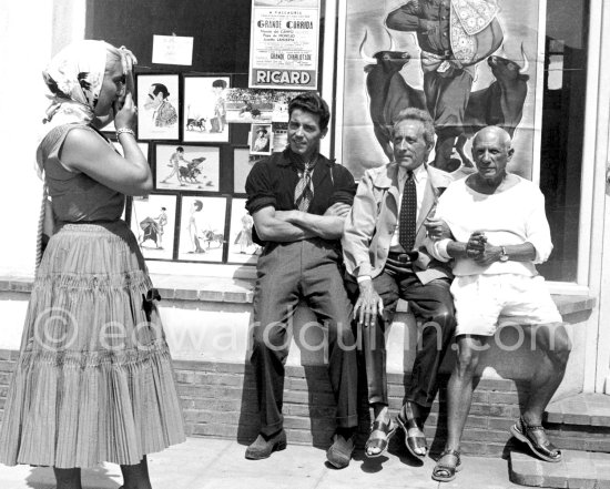 Maya Picasso takes photos with the Minox camera of Pablo Picasso of Jean Cocteau, his adopted son Edouard Dermit and her father. Vallauris 1955. - Photo by Edward Quinn