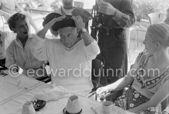 Local Corrida. Restaurant Le Vallauris. Pablo Picasso as bullfighter. On the left Francine Weisweiller, right Dr. Jeanne Creff (acupuncturist of Pablo Picasso). Vallauris 1955. - Photo by Edward Quinn