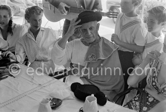 At the lunch given for his friends by Pablo Picasso at restaurant Le Vallauris before the bullfight, he dresses up as toreador for his friends. Francine Weisweiller on the left. Vallauris 1955. - Photo by Edward Quinn