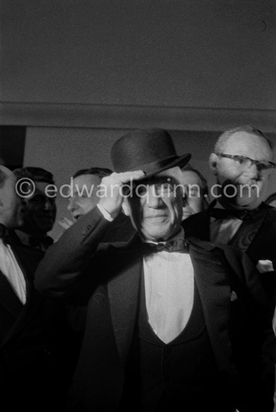 Pablo Picasso attending the showing of "Le mystère Picasso". Douglas Cooper in the background. Cannes Film Festival 1956. - Photo by Edward Quinn