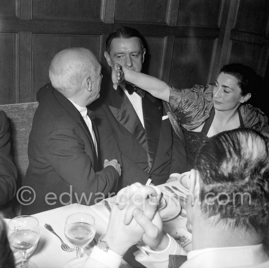 Pablo Picasso, Jacqueline and film music composer Georges Auric attending the showing of "Le mystère Picasso". Cannes Film Festival 1956. - Photo by Edward Quinn