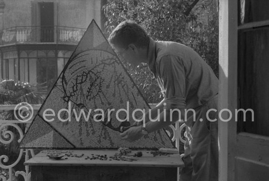 Hjalmar Boyesen. He collaborated with Picasso during 1956.-1958, and executed some mosaics for him. The triangle shape mosaic is made after a design by Jean Cocteau. Based on Cocteau’s journal, it was made in October 1956. and it is representing the crucifixion. - Photo by Edward Quinn