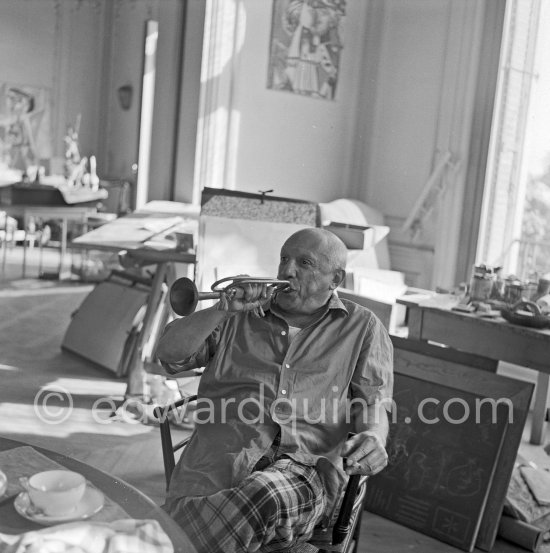 Pablo Picasso with trumpet. La Californie, Cannes 1956. - Photo by Edward Quinn