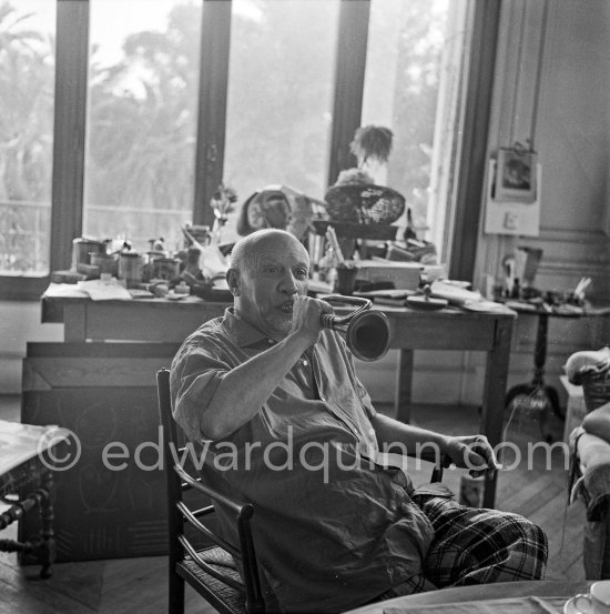 Pablo Picasso with trumpet. La Californie, Cannes 1956. - Photo by Edward Quinn