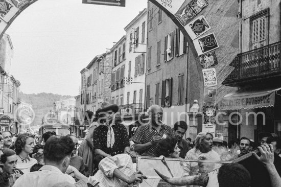 Pablo Picasso and Maya Picasso at the traditional parade after the local corrida in a Renault 1925 with bull\'s horns. Avenue Georges Clément 14, on the right entrance to Nérolium. Vallauris 1956. Same situation of today see Pic560419 - Photo by Edward Quinn