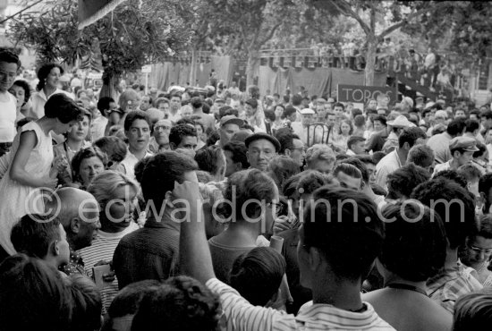 Pablo Picasso and Maya Picasso in the crowd. Before the local Corrida, Vallauris 1956 - Photo by Edward Quinn