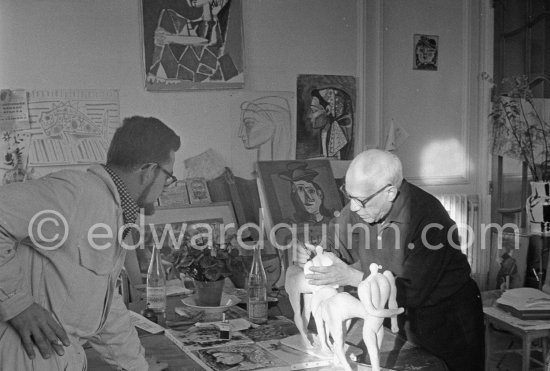 Pablo Picasso working on two plasters of "Centaure". With Jean Ramié. La Californie, Cannes 1956. - Photo by Edward Quinn
