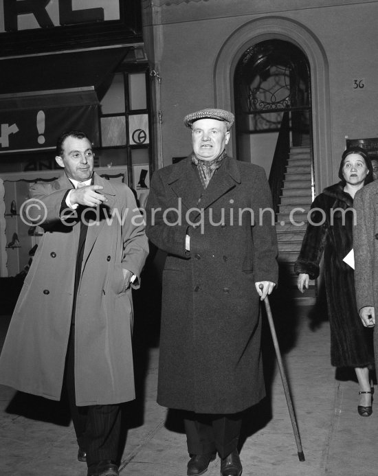 With an english style cap and walking stick, Maurice Thorez, communist party leader, and his bodyguard leave the exhibition "Pablo Picasso. Un Demi-Siècle de Livres Illustrés". Galerie H. Matarasso. 21.12.1956-31.1.1957. Nice 1956. - Photo by Edward Quinn