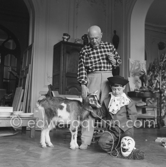Picasso with Claude dressed up as a clown, Paloma as a trapper. With goat Esmeralda. La Californie, Cannes 1956. - Photo by Edward Quinn