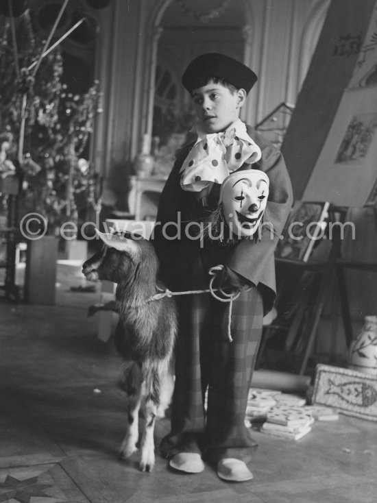 Claude Picasso dressed up as a clown. With goat Esmeralda. La Californie, Cannes 1956. - Photo by Edward Quinn