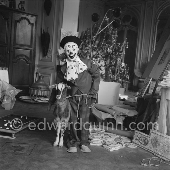 Claude Picasso dressed up as a clown. With goat Esmeralda. La Californie, Cannes 1956. - Photo by Edward Quinn