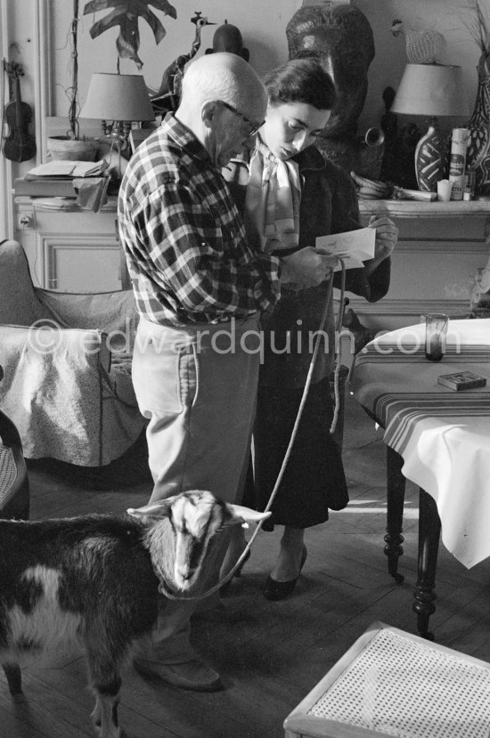 Pablo Picasso and Jacqueline reading a Christmas card. The goat Esmeralda was a Christmas present from Jacqueline. La Californie, Cannes 1956. - Photo by Edward Quinn