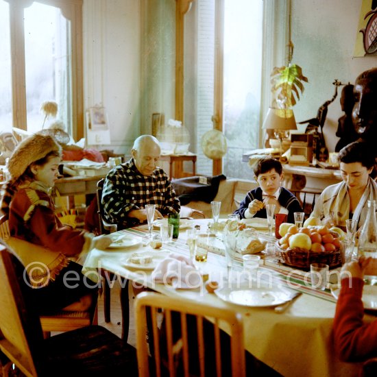 Pablo Picasso, Jacqueline, Paloma Picasso and Claude Picasso at Christmas. Paloma is wearing the Davy Crockett trapper outfit she received as a Christmas present. La Californie, Cannes 1956. - Photo by Edward Quinn