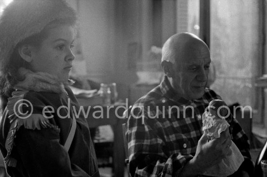 Pablo Picasso and Paloma Picasso at Christmas. Paloma Picasso is wearing the Davy Crockett trapper outfit she received as a Christmas present. La Californie, Cannes 1956. - Photo by Edward Quinn