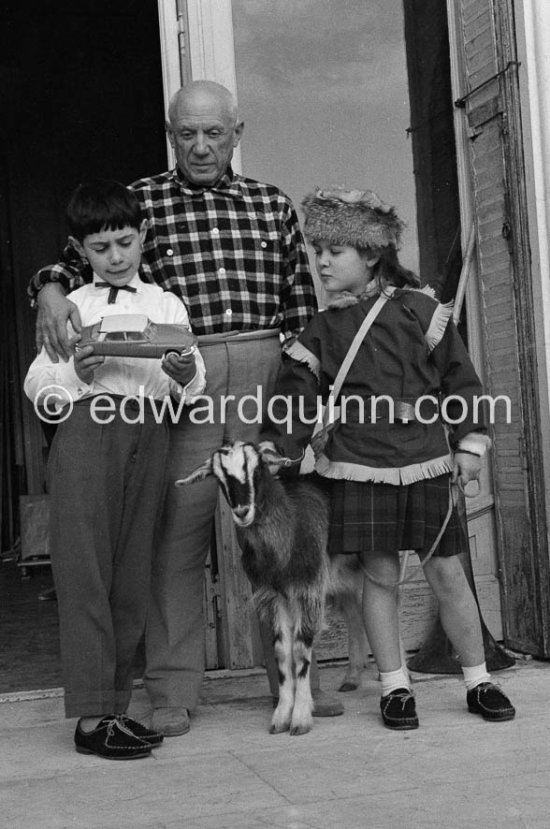 Picasso, Claude (with his toy Citroën DS) and Paloma at Christmas with Esmeralda. La Californie, Cannes 1956. - Photo by Edward Quinn