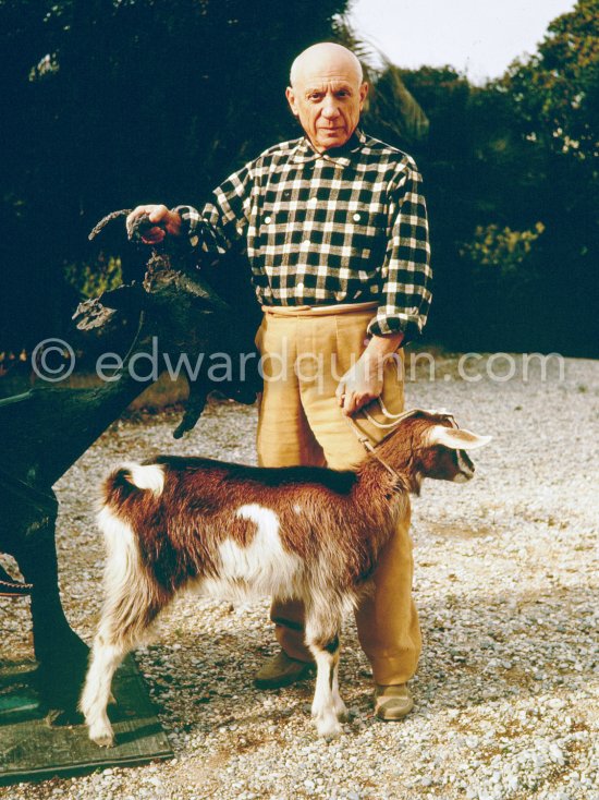 Pablo Picasso and Paloma Picasso at Christmas with Esmeralda, the goat he received from Jacqueline. Paloma Picasso is wearing the Davy Crockett trapper outfit she received as a Christmas present. La Californie, Cannes 1956. - Photo by Edward Quinn