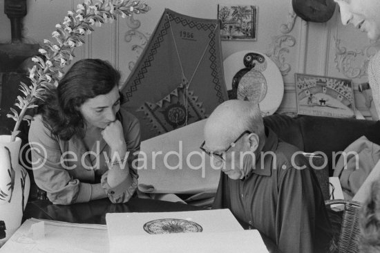 Pablo Picasso and Jacqueline viewing a book about Bernard Palissy, French potter of the 16th century. La Californie, Cannes 1957. - Photo by Edward Quinn