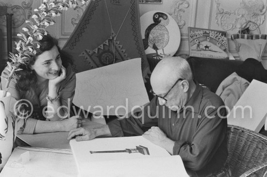 Pablo Picasso and Jacqueline viewing a book about Bernard Palissy, French potter of the 16th century. La Californie, Cannes 1957. - Photo by Edward Quinn