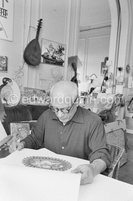 Pablo Picasso and Jacqueline viewing a book about Bernard Palissy, French potter of the 16th century. La Californie, Cannes 1957. - Photo by Edward Quinn