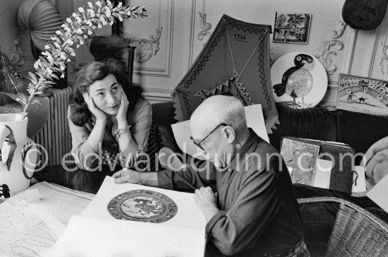 Picasso and Jacqueline viewing a book about Bernard Palissy, French potter of the 16th century. La Californie, Cannes 1957. - Photo by Edward Quinn