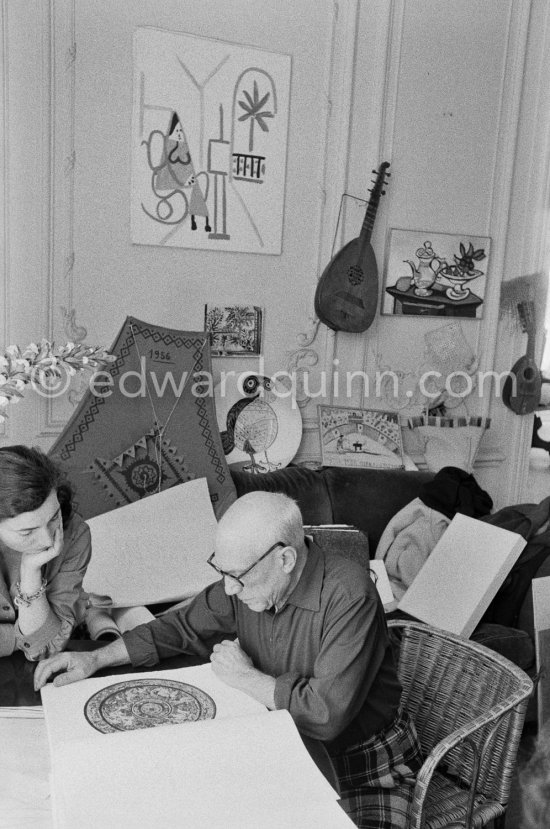 Pablo Picasso and Jacqueline viewing a book about Bernard Palissy, French potter of the 16th century. La Californie, Cannes 1957. - Photo by Edward Quinn