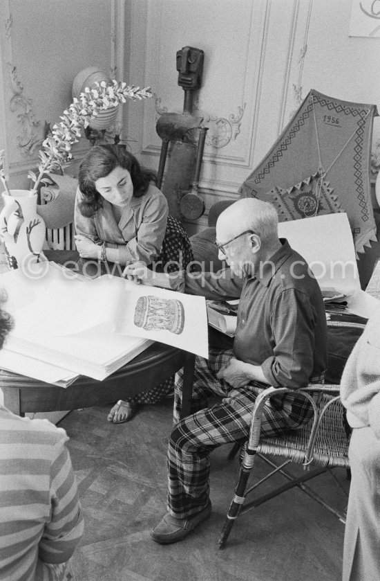 Pablo Picasso and Jacqueline viewing a book about Bernard Palissy, French potter of the 16th century. La Californie, Cannes 1957. - Photo by Edward Quinn