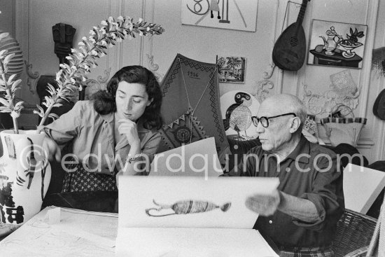 Picasso and Jacqueline viewing a book about Bernard Palissy, French potter of the 16th century. La Californie, Cannes 1957. - Photo by Edward Quinn