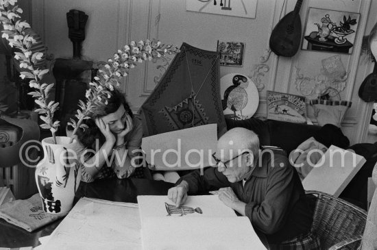 Pablo Picasso and Jacqueline viewing a book about Bernard Palissy, French potter of the 16th century. La Californie, Cannes 1957. - Photo by Edward Quinn