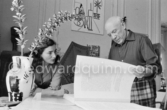 Pablo Picasso and Jacqueline viewing a book about Bernard Palissy, French potter of the 16th century. La Californie, Cannes 1957. - Photo by Edward Quinn