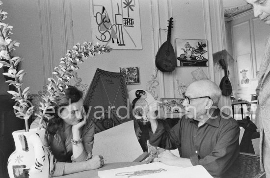 Pablo Picasso and Jacqueline viewing a book about Bernard Palissy, French potter of the 16th century. La Californie, Cannes 1957. - Photo by Edward Quinn