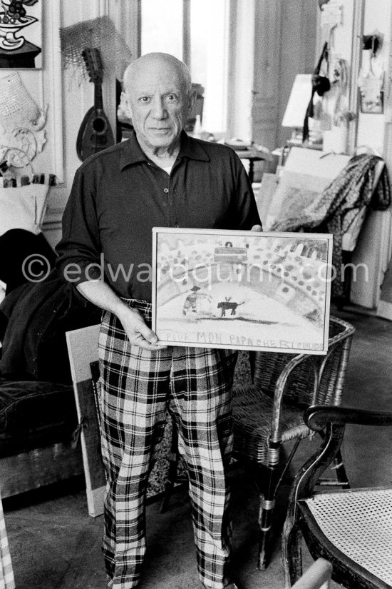 Picasso with bullfight painting by Claude. La Californie, Cannes 1957. - Photo by Edward Quinn