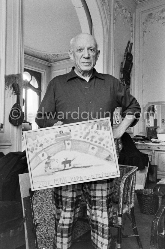Pablo Picasso with bullfight painting by Claude Picasso. La Californie, Cannes 1957. - Photo by Edward Quinn