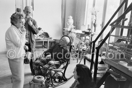 Pablo Picasso showing Suzanne and George Ramié wood sculptures "The Bathers (Les Baigneuses). On the right Jacqueline. Birdcage. La Californie, Cannes 1957. - Photo by Edward Quinn