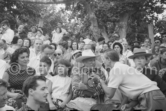 Local Corrida. Inès Sassier, Pablo Picasso\'s housekeeper, Gérard Sassier, Claude Picasso, Paloma Picasso, on the right French lady bullfighter Pierrette Le Bourdiec. Pablo Picasso interviewed for RTF. Vallauris 1957. - Photo by Edward Quinn