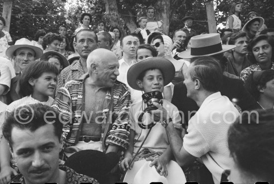 Local Corrida. Paloma Picasso, behind her Paul Derigon, the mayor of Vallauris, Pablo Picasso, Claude Picasso interviewed for RTF. Vallauris 1957. - Photo by Edward Quinn