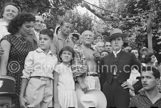 Local Corrida. Inès Sassier, Pablo Picasso\'s housekeeper, Gérard Sassier, behind him Paul Derigon, the mayor of Vallauris, Paloma Picasso, Pablo Picasso, French lady bullfighter Pierrette Le Bourdiec. Vallauris 1957. - Photo by Edward Quinn