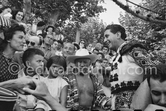 Local Corrida. Inès Sassier, Pablo Picasso's housekeeper, Gérard Sassier, Paloma Picasso, Pablo Picasso, Francisco Reina "El Minuni", banderillero andaluz. Vallauris 1957. - Photo by Edward Quinn