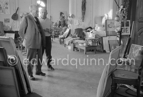 Jaime Sabartés and Pablo Picasso critically examine a portrait of Jacqueline. Pablo Picasso valued Sabartés\' opinion highly. They met in 1899 as members of a group of artists which regularly met in the els 4 gats, a cafe in Barcelona. They remained friends ever since. La Californie, Cannes 1957. - Photo by Edward Quinn