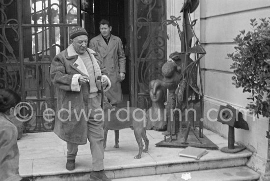 Pablo Picasso at the entrance of La Californie with his chauffeur and boxer dog Jan. Cannes 1958. - Photo by Edward Quinn