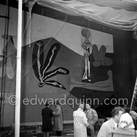 Installation of mural "The Fall of Icarus" ("La chute d'Icare") on a schoolyard in Vallauris. Destined for the conference hall of UNESCO building in Paris. The mural is made up of forty wooden panels. Initially titled "The Forces of Life and the Spirit Triumphing over Evil", the composition was renamed in 1958 by George Salles, who preferred the current title, "The Fall of Icarus" ("La chute d'Icare"). Vallauris, 29 March 1958. - Photo by Edward Quinn