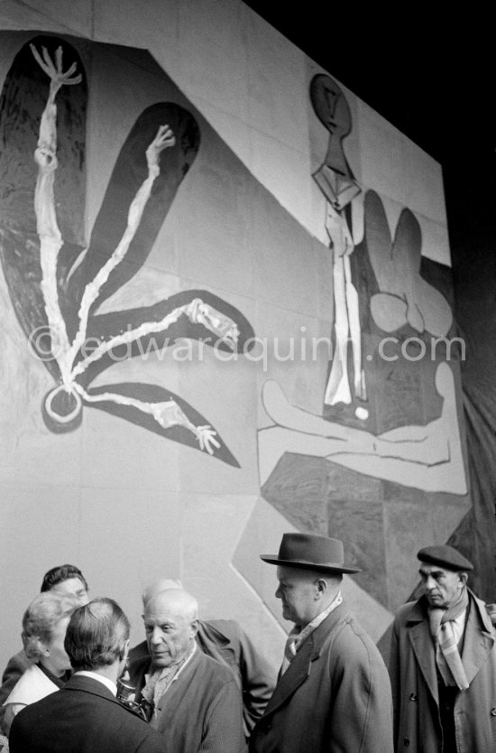 Pablo Picasso and Maurice Thorez, leader of the French Communist Party (PCF). Unveiling of mural "The Fall of Icarus" ("La chute d\'Icare") for the conference hall of UNESCO building in Paris. The mural is made up of forty wooden panels. Initially titled "The Forces of Life and the Spirit Triumphing over Evil", the composition was renamed in 1958 by George Salles, who preferred the current title, "The Fall of Icarus" ("La chute d\'Icare"). Vallauris, 29 March 1958. - Photo by Edward Quinn
