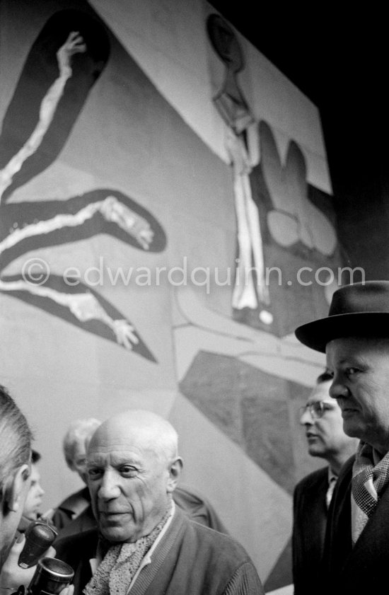 Pablo Picasso and Maurice Thorez, leader of the French Communist Party (PCF). Unveiling of mural "The Fall of Icarus" ("La chute d\'Icare") for the conference hall of UNESCO building in Paris. The mural is made up of forty wooden panels. Initially titled "The Forces of Life and the Spirit Triumphing over Evil", the composition was renamed in 1958 by George Salles, who preferred the current title, "The Fall of Icarus" ("La chute d\'Icare"). Vallauris, 29 March 1958. - Photo by Edward Quinn