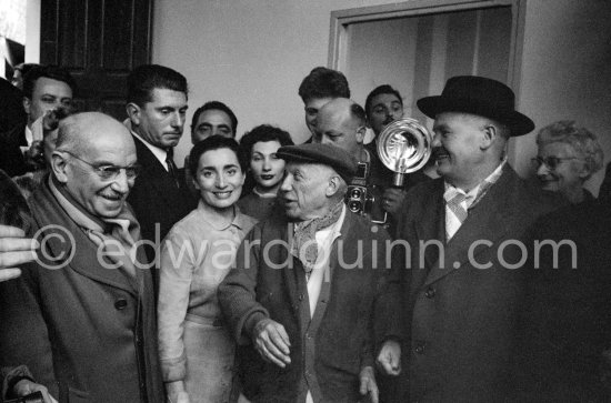 Paulo Picasso, Jacqueline, Pablo Picasso, Maurice Thorez, leader of the French Communist Party (PCF). Unveiling of mural "The Fall of Icarus" ("La chute d\'Icare") for the conference hall of UNESCO building in Paris. The mural is made up of forty wooden panels. Initially titled "The Forces of Life and the Spirit Triumphing over Evil", the composition was renamed in 1958 by George Salles, who preferred the current title, "The Fall of Icarus" ("La chute d\'Icare"). Vallauris, 29 March 1958. - Photo by Edward Quinn