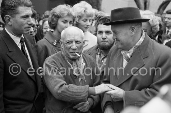 Pablo Picasso, Paulo Picasso, Maurice Thorez. Unveiling of mural "The Fall of Icarus" ("La chute d\'Icare") for the conference hall of UNESCO building in Paris. The mural is made up of forty wooden panels. Initially titled "The Forces of Life and the Spirit Triumphing over Evil", the composition was renamed in 1958 by George Salles, who preferred the current title, "The Fall of Icarus" ("La chute d\'Icare"). Vallauris, 29 March 1958. - Photo by Edward Quinn