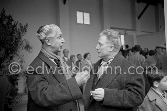 Georges Salles, President of the ICOM (left) and Edouard Pignon. Unveiling of mural "The Fall of Icarus" for the conference hall of UNESCO building in Paris. The mural is made up of forty wooden panels. Initially titled "The Forces of Life and the Spirit Triumphing over Evil", the composition was renamed in 1958 by George Salles, who preferred the current title, "The Fall of Icarus". Vallauris, 29 March 1958. - Photo by Edward Quinn