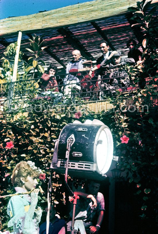 Francine Weisweiller during filming of "Le Testament d’Orphée", film of Jean Cocteau. On the balcony Catherine Hutin, Alberto Magnelli, Pablo Picasso, Michele Sapone and Sabartés. At Villa Santo Sospir of Francine Weisweiller. Saint-Jean-Cap-Ferrat 1959. - Photo by Edward Quinn